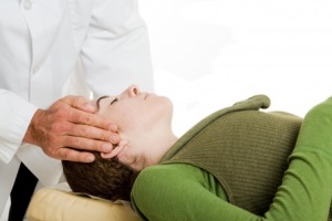 Chiropractic patient receiving a cervical spine adjustment