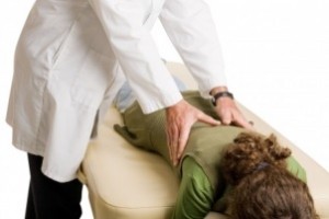 chiropractor performing orthogonal adjustment on patient